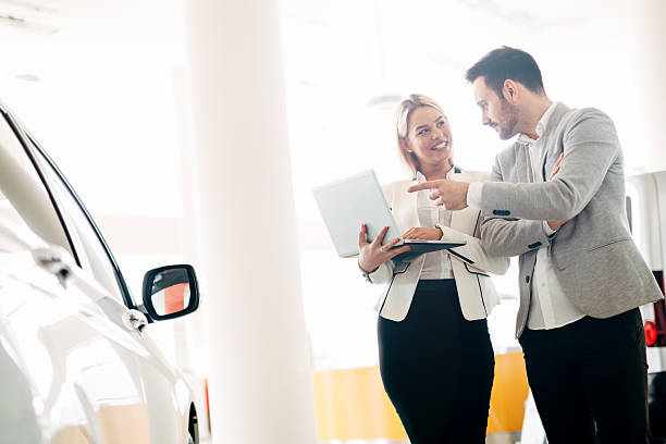 istock Customer looking for a car at dealership 578300776