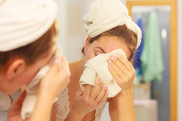 istock Woman washing face in bathroom. Hygiene 578301182