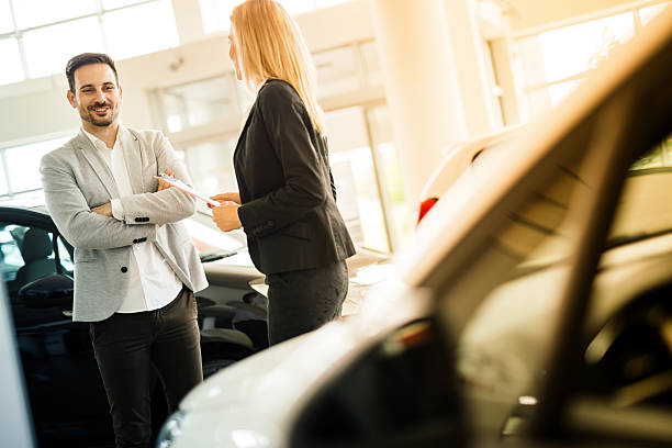 istock Salesperson showing vehicle to potential customer 578301258