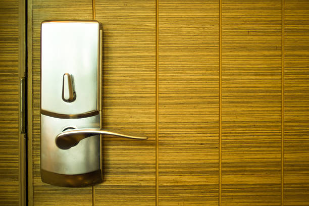 istock Digital door lock in wood door background. 578301352