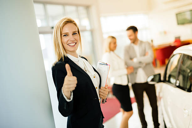 istock Salesperson showing vehicle to potential customer 578301492