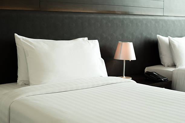 istock Interior,pillow bed lamp in bedroom in morning. 578302228