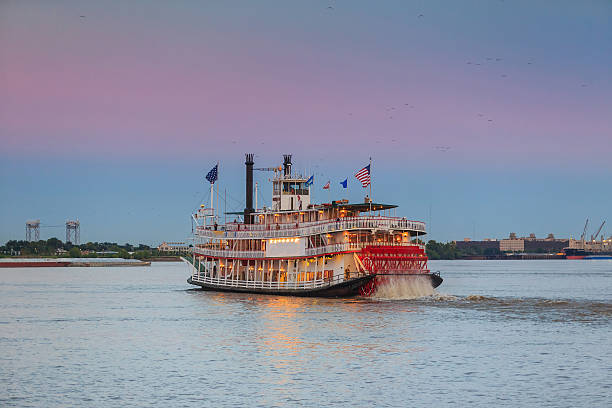 New Orleans paddle steamer in Mississippi river in New Orleans New Orleans paddle steamer in Mississippi river in New Orleans,   Louisiana passenger craft stock pictures, royalty-free photos & images