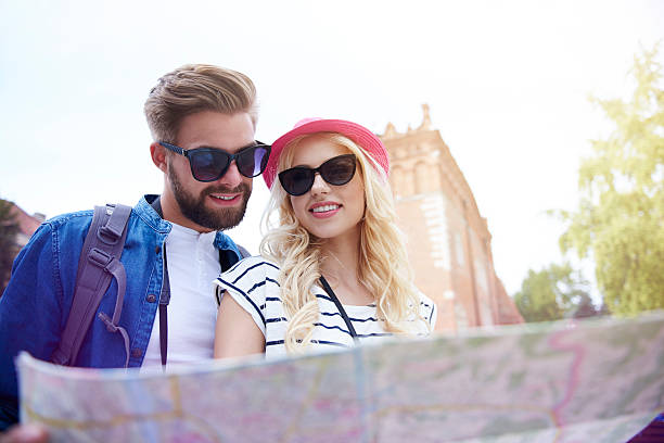 istock Low angle view of couple with paper map 578304822