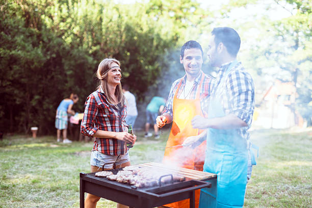 istock Young people grilling outdoors 578306164