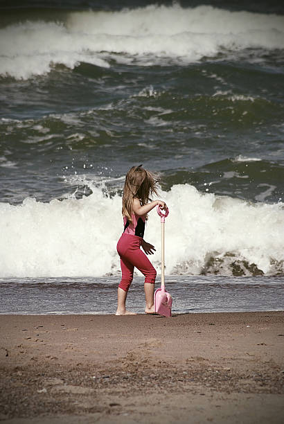 istock Three-year girl on the beach v 578307156