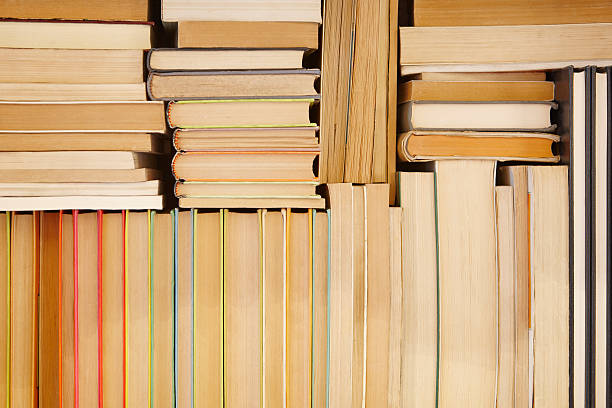 istock Antique books stacked on a storage rack. Read background 578307484