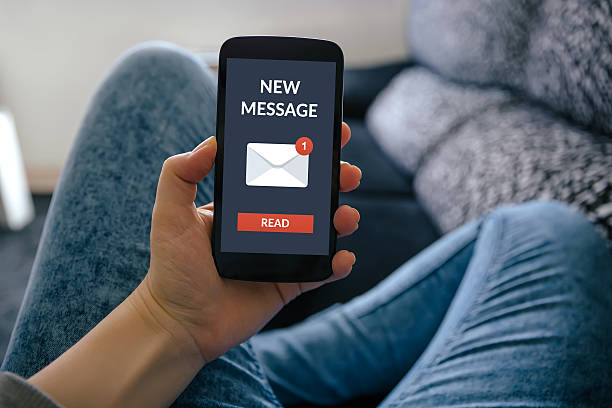 istock Girl holding smart phone with new message concept on screen 578307772