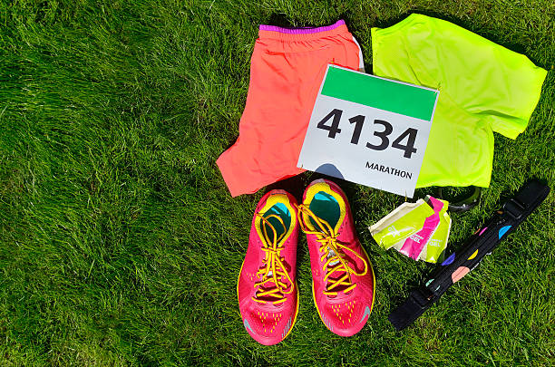 istock Running shoes, marathon race bib (number), runners gear 578308122