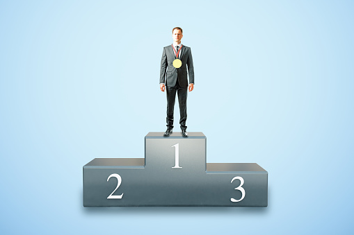 Businessman with medal on first place pedestal and blue background. 3D Rendering