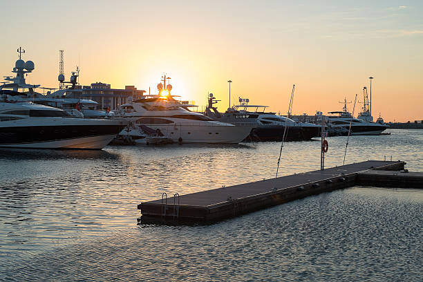 istock Yachts in a port at  sunset 578308872