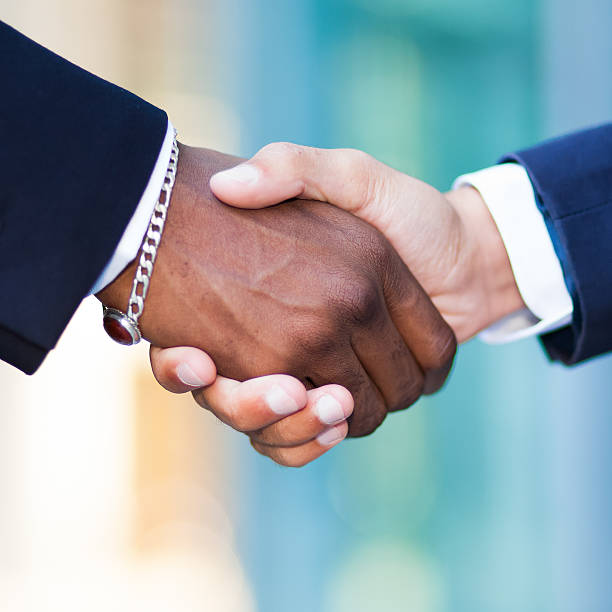 istock African businessman shaking hands with a caucasian one 578311040
