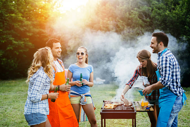 istock Friends having a barbecue party in nature 578311760