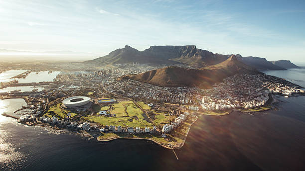 Aerial view of Cape Town, South Africa Aerial view of Cape Town with Cape Town Stadium, Lion's Head and Table mountain. lions head mountain stock pictures, royalty-free photos & images