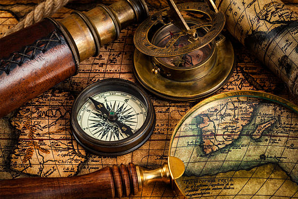 istock Old vintage compass and travel instruments on ancient map 578554470