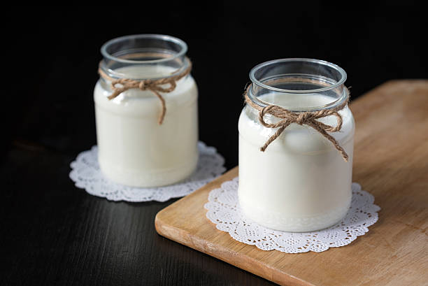 istock natural yogurt in a jar on the dark background 578555578
