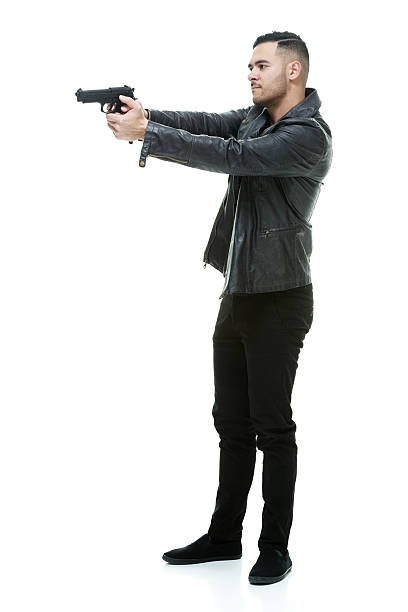 istock Angry casual man aiming with gun 578555618