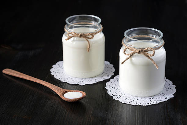 istock natural yogurt in a jar on the dark background 578555686