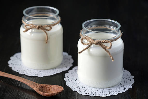 istock natural yogurt in a jar on the dark background 578555762