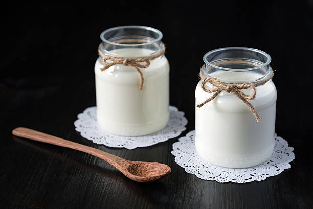 istock natural yogurt in a jar on the dark background 578555868