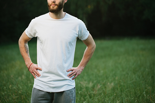 Hipster man wearing white blank t-shirt with space for your logo