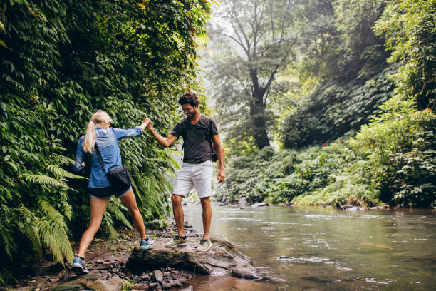 istock Couple of hikers in forest 578557224
