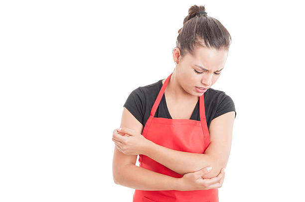 istock Supermarket employee having elbow medical problem 578557550