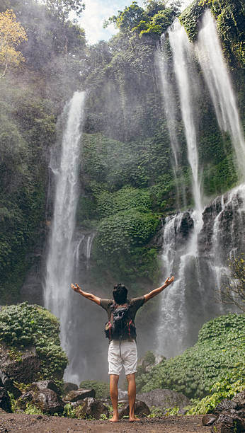 istock Male tourist enjoying near waterfall 578558162