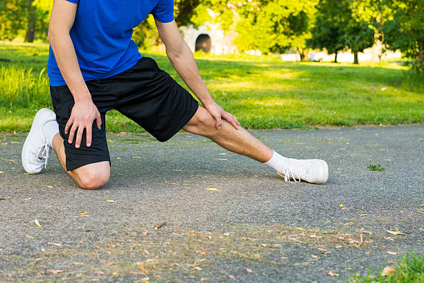 istock Sportsman stretching his leg 578558886