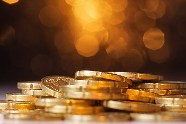 istock Euro coins over abstract defocused lights 578560398