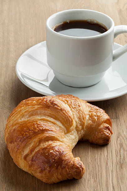 istock Fresh baked croissant and coffee 578561014