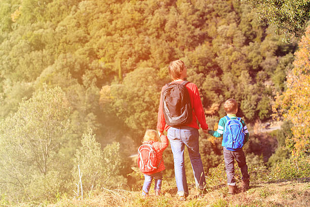 istock father with two kids travel in mountains 578563814