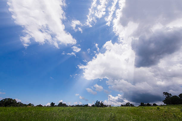istock nature background,ray light with sky clouds over field 578567386