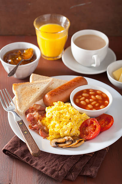 istock full english breakfast with scrambled eggs, bacon, sausage, bean 578567562