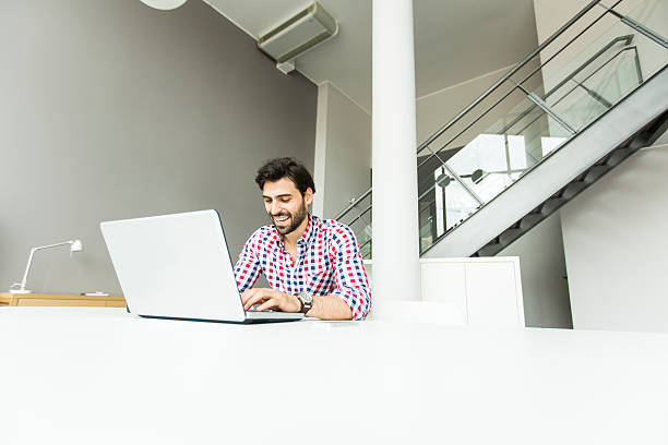 istock Young man at the office 578570994