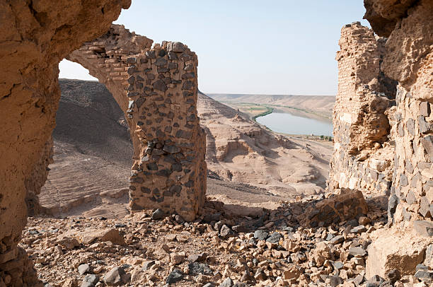 Euphrates River and Halabiye ruins in Syria View of the Euphrates River through the ruins of Halabiye Fortress in Syria. The fortress was founded by Queen Zenobia in the 3rd century AD. euphrates syria stock pictures, royalty-free photos & images