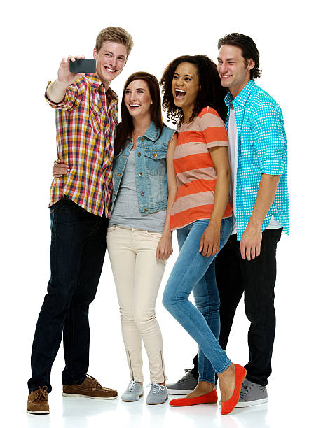 Smiling four friends taking a selfie