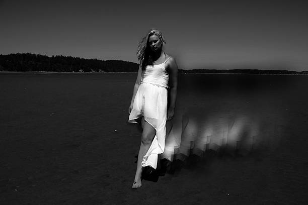 istock black and white portrait woman on beach 578575376
