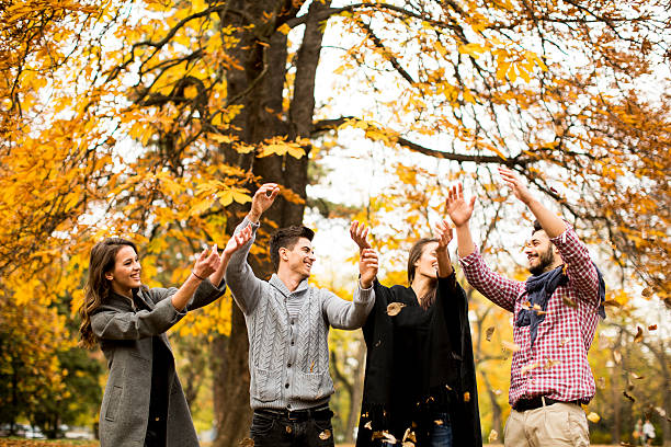 istock Young people having fun in the autumn park 578575852