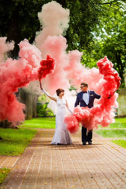istock The bride and bridegroom with a red smoke 578576308