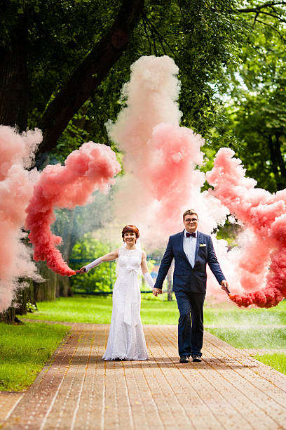istock The bride and bridegroom with a red smoke 578576358