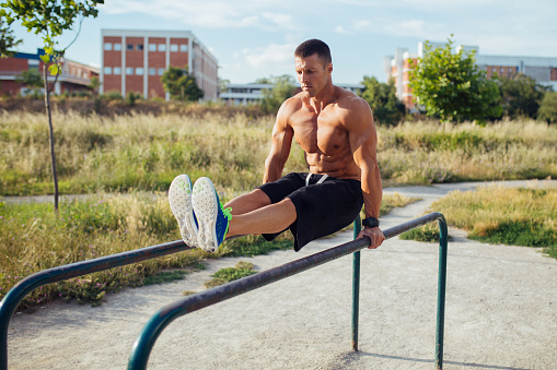 Fit young man exercising outdoors