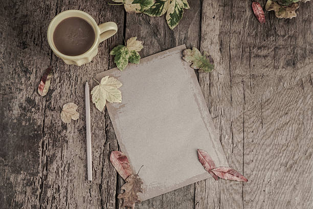 istock coffee and notebook on wooden table decorated with autumn leaves 578577894