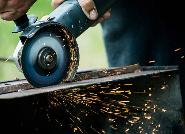 istock Closeup of worker using a grinder on a metal plate 578579734
