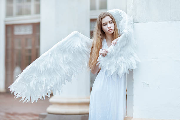 istock Young woman with white wings 578580554