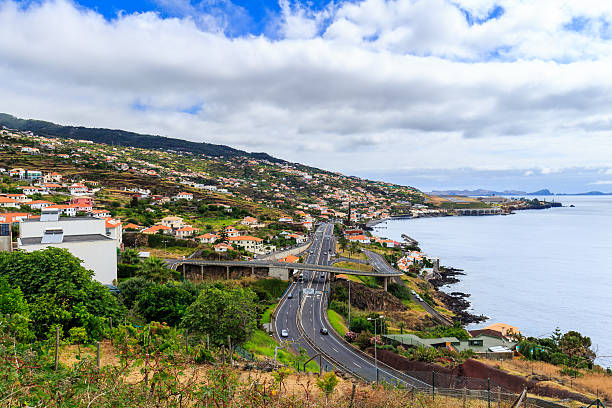 Coastline Madeira with Highway along Santa Cruz Coastline Madeira with Highway along Santa Cruz and a view at the airport, Madeira, Portugal funchal christmas stock pictures, royalty-free photos & images