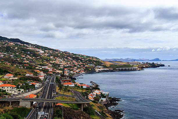 Coastline Madeira with Highway along Santa Cruz Coastline Madeira with Highway along Santa Cruz and a view at the airport, Madeira, Portugal funchal christmas stock pictures, royalty-free photos & images