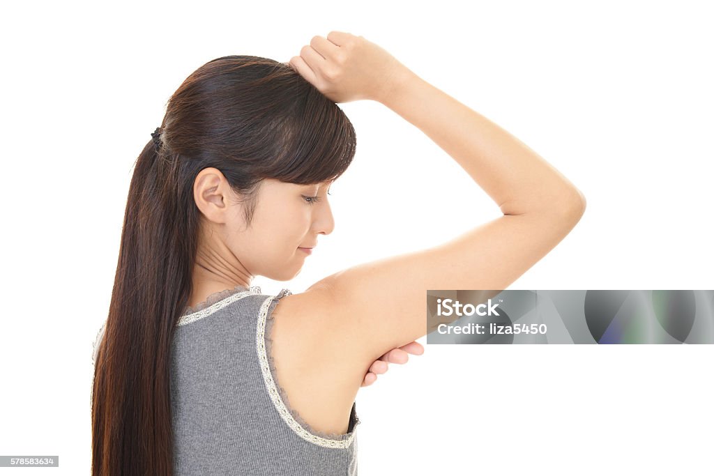 Smiling young woman The woman who is doing skin care Armpit Stock Photo