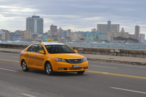 Havana, Cuba - January, 19th, 2016: Geely Emgrand7 in taxi version driving on the street. The Geely cars are the one of the most popular new vehicles in Cuba.