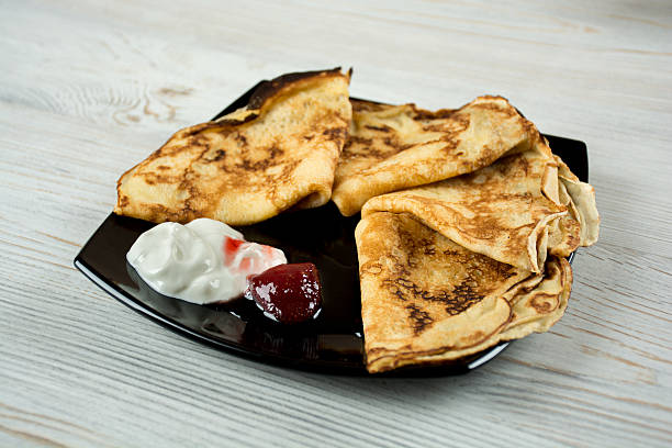 istock Pancakes with sour cream and strawberry jam 578587608